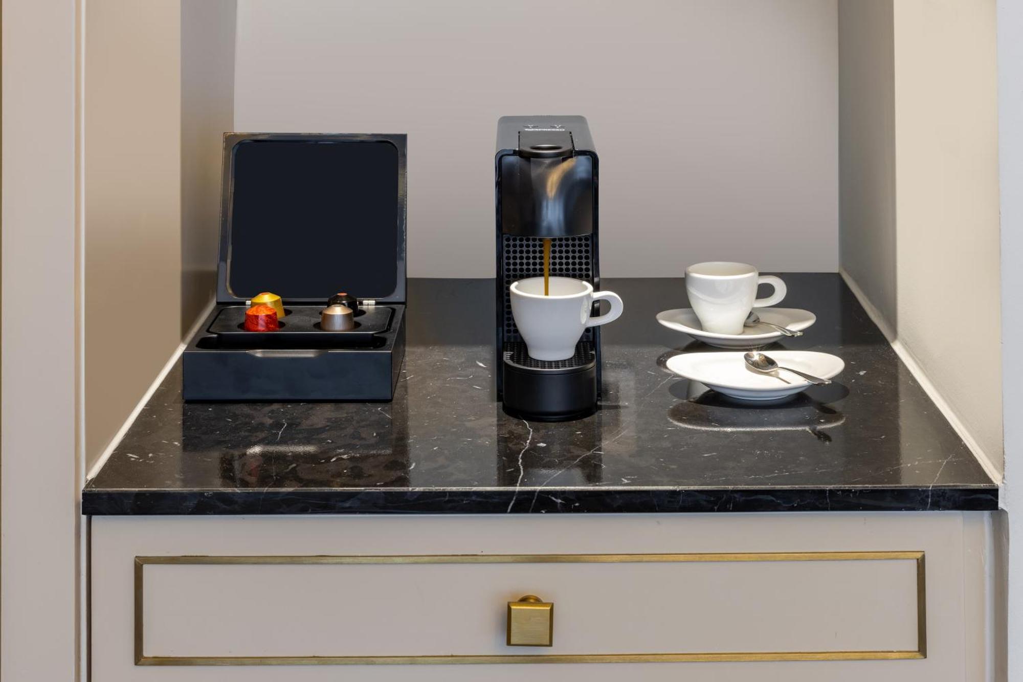 Melia Vinpearl Hue Hotel Exterior photo A Nespresso coffee machine in a hotel room